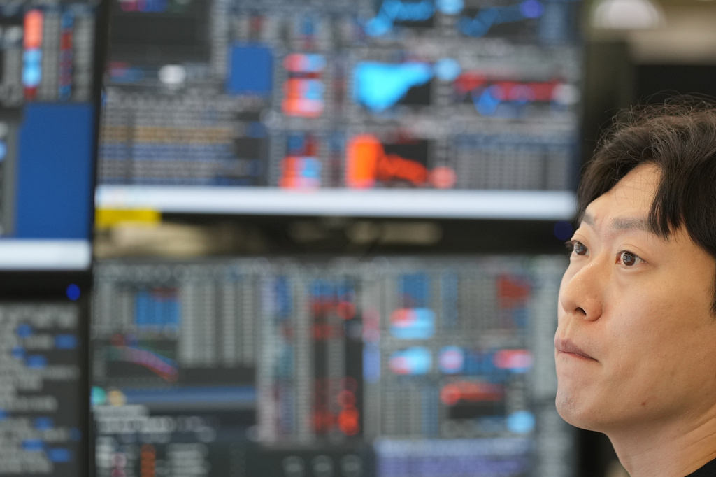 A dealer watches computer monitors at a dealing room of Hana Bank in Seoul, South Korea, Monday, May 4, 2026. (AP Photo/Lee Jin-man)