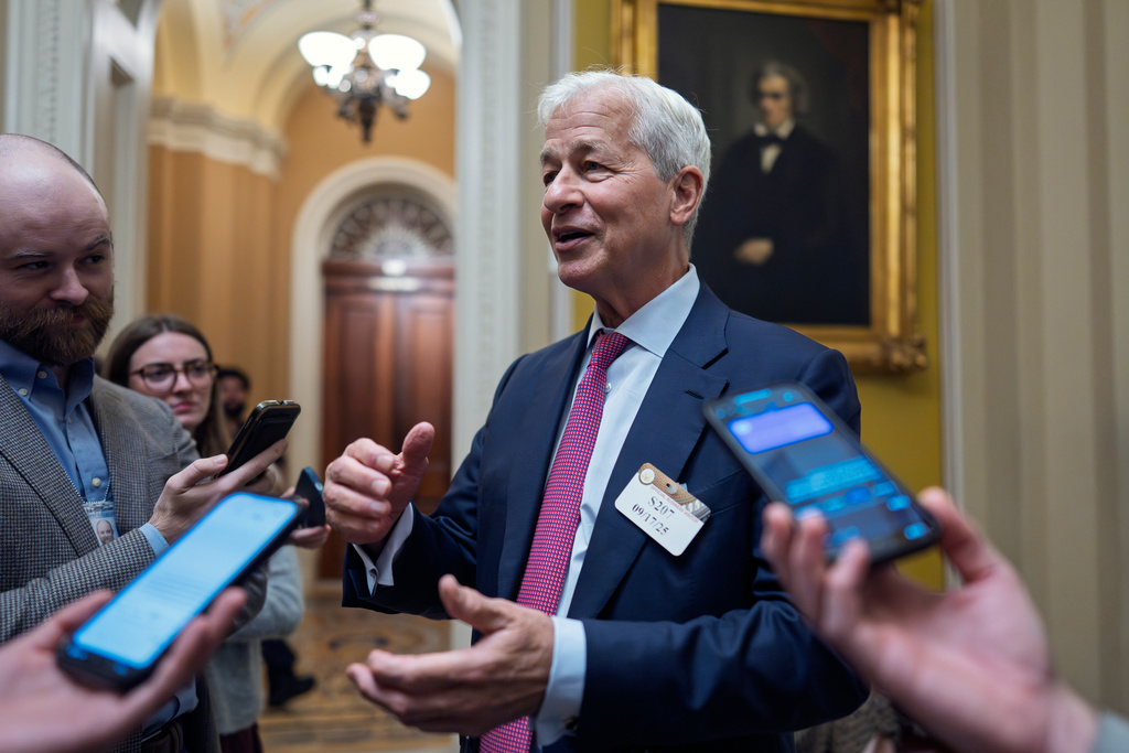 Jamie Dimon, CEO and chairman of JPMorgan Chase, pauses to talk to reporters after lunch with Republican senators to discuss the economy, at the Capitol in Washington, Wednesday, Sept. 17, 2025. (AP Photo/J. Scott Applewhite)
