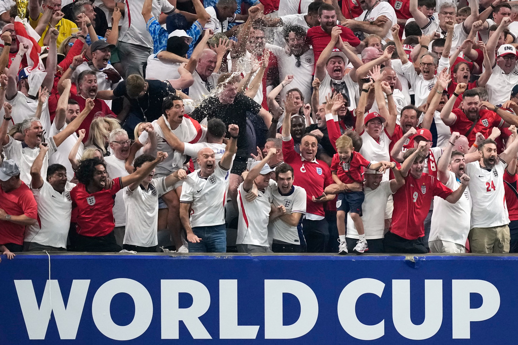 England fans react after England's Anthony Gordon scored the opening goal during the World Cup semifinal soccer match between England and Argentina in Atlanta, Wednesday, July 15, 2026. (AP Photo/Rebecca Blackwell)