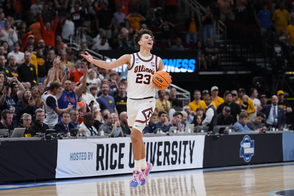 Illinois' Keaton Wagler celebrates after Illinois beat Iowa in an Elite Eight game in the NCAA college basketball tournament Saturday, March 28, 2026, in Houston. (AP Photo/Eric Gay)