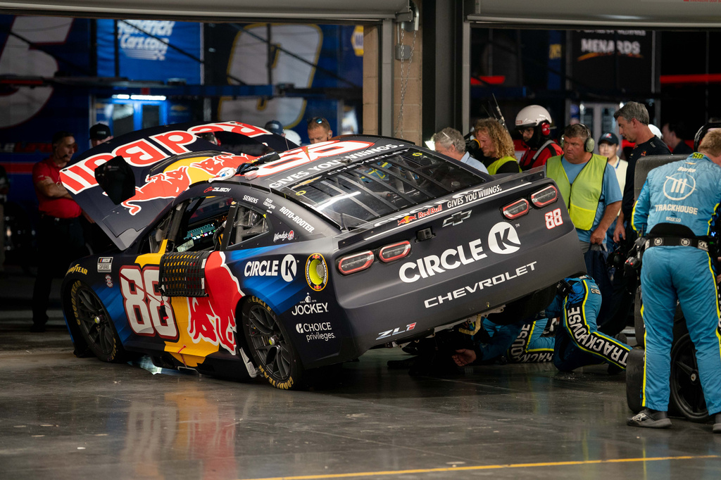 Crew members work on Connor Zilisch's car after a wreck during a NASCAR Cup Series auto race, Sunday, May 31, 2026, in Lebanon, Tenn. (AP Photo/Camden Hall)