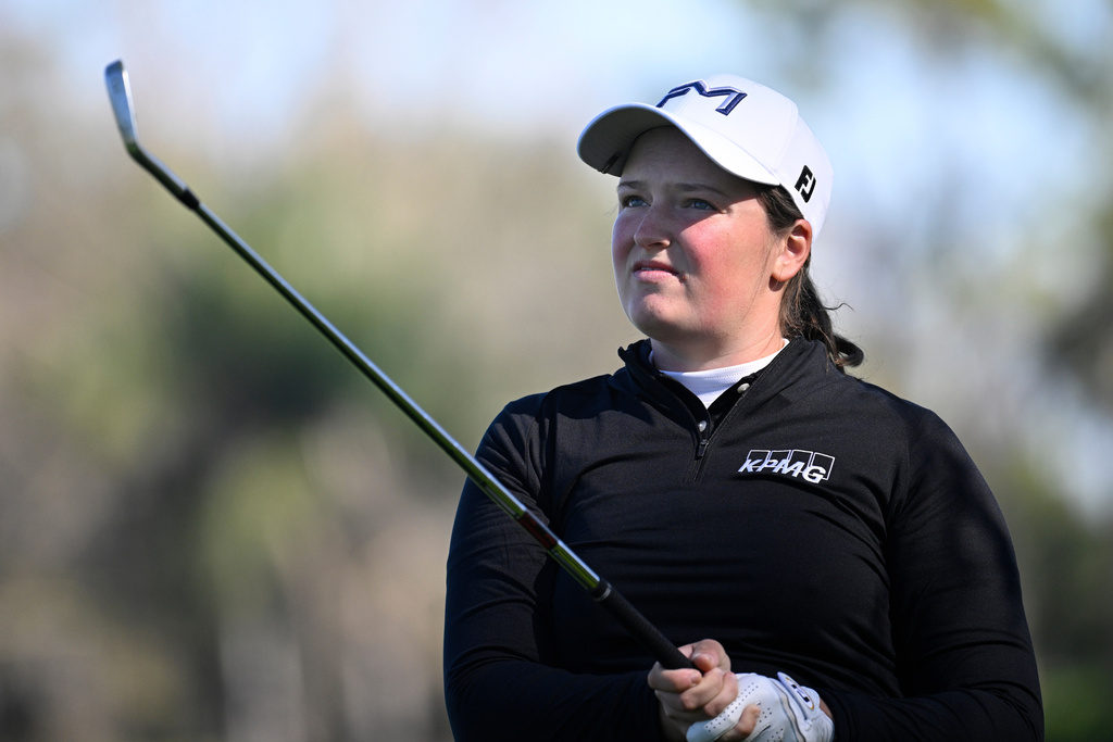 Lottie Woad of England, watches the flight of the ball after hitting from the seventh fairway during the first round of the Tournament of Champions LPGA golf tournament, Thursday, Jan. 29, 2026, in Orlando, Fla. (AP Photo/Phelan M. Ebenhack)