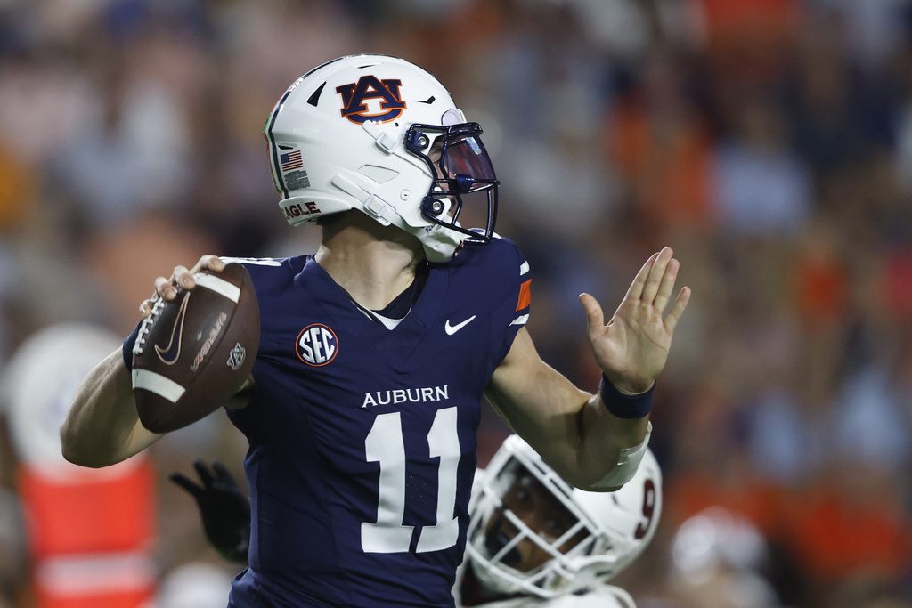 Auburn quarterback Jackson Arnold (11) throws a pass against Ball State during the first half of an NCAA college football game, Saturday, Sept. 6, 2025, in Auburn, Ala. (AP Photo/Butch Dill)