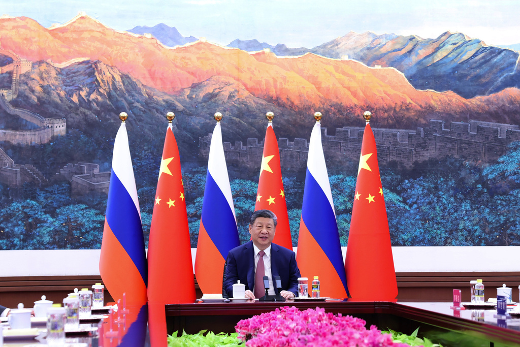 In this photo released by Xinhua News Agency, Chinese President Xi Jinping holds a virtual meeting with Russian President Vladimir Putin, unseen, at the Great Hall of the People in Beijing on Wednesday, Feb. 4, 2026. (Huang Jingwen/Xinhua via AP)