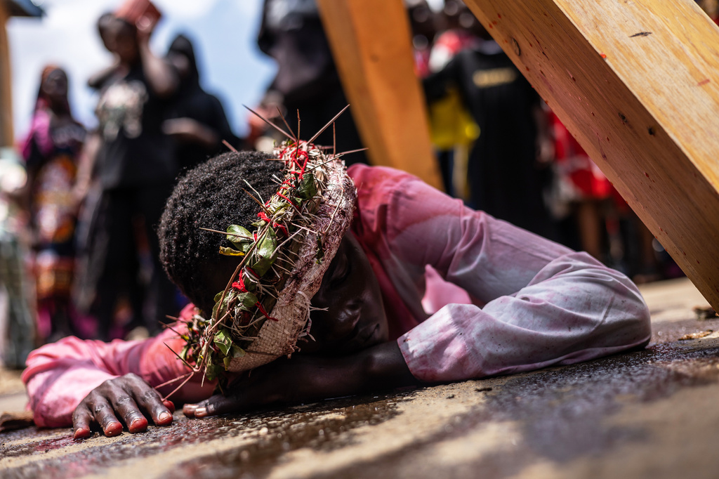 Christians take part in a Way of the Cross re-enactment of the crucifixion of Jesus Christ on Good Friday during Holy Week in Kibera informal settlement in Nairobi, Kenya, Friday, April 3, 2026. (AP Photo/Samson Otieno)