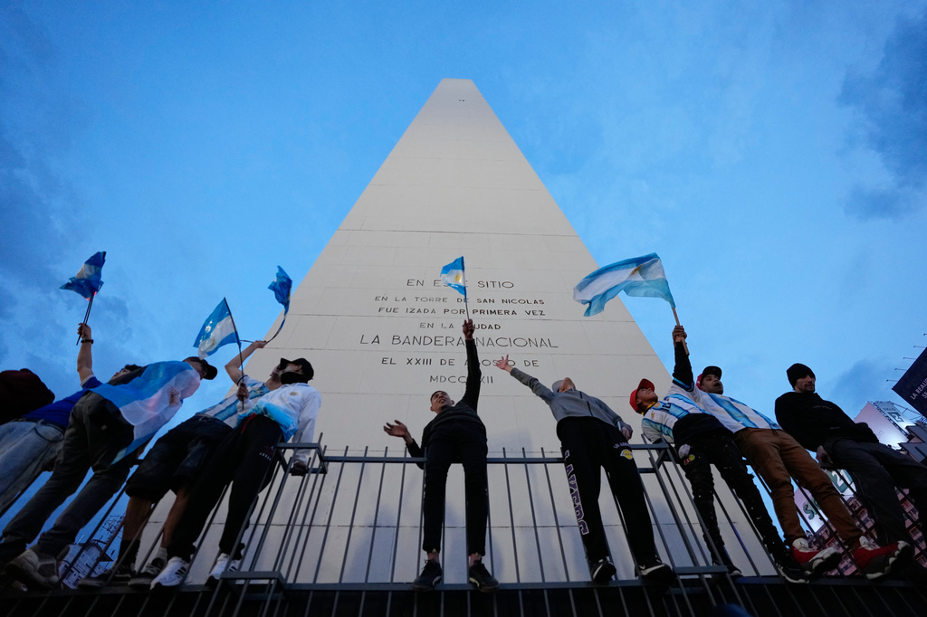 Fans celebrate after Argentina defeated England in a World Cup semifinal soccer match in downtown Buenos Aires, Argentina, Wednesday, July 15, 2026. (AP Photo/Natacha Pisarenko)