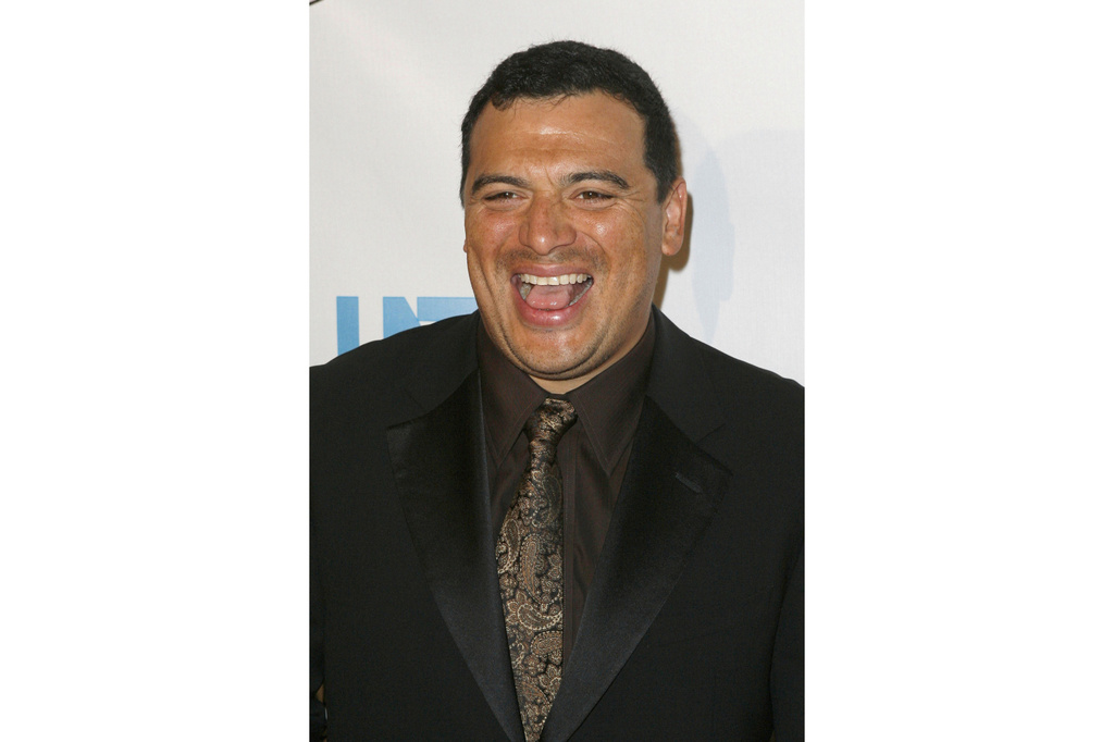 FILE - Actor and comedian Carlos Mencia arrives at the 23rd Annual Imagen Awards, Aug. 21, 2008, in Beverly Hills, Calif. (AP Photo/Gus Ruelas, File)