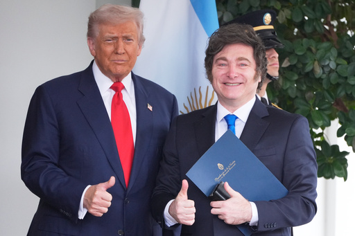 President Donald Trump greets Argentina's President Javier Milei, as he arrives at the White House, Tuesday, Oct. 14, 2025, in Washington. (AP Photo/Mark Schiefelbein) President Donald Trump greets Argentina's President Javier Milei, as he arrives at the White House, Tuesday, Oct. 14, 2025, in Washington. (AP Photo/Mark Schiefelbein)