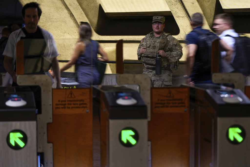 A South Carolina National Guardsman patrols outside the Foggy Bottom-GWU metro station, Wednesday, Aug. 20, 2025, in Washington. (AP Photo/Julia Demaree Nikhinson)