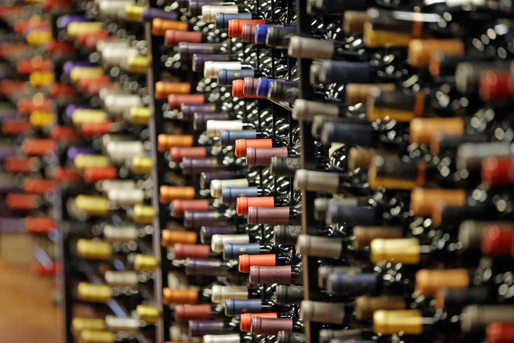 FILE - Bottles of wine are displayed during a tour of a state liquor store, in Salt Lake City, June 16, 2016. (AP Photo/Rick Bowmer, File)