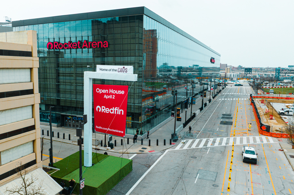 This recent image provided by Redfin shows a giant "Open House" sign displayed outside of Rocket Arena, home of the NBA basketball team the Cleveland Cavaliers, in Cleveland. (Cleveland Cavaliers/Redfin via AP)