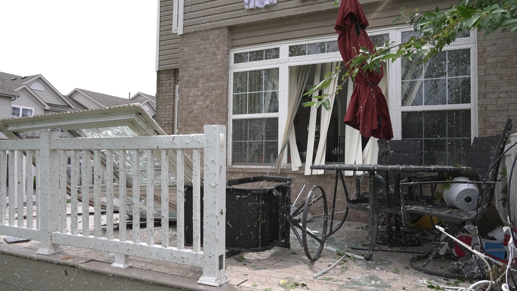 In this image made from video, damage caused by a strong storm is seen a home in Tinley Park, Ill., Tuesday, Aug. 11, 2026. (AP Photo/Laura Bargfeld)