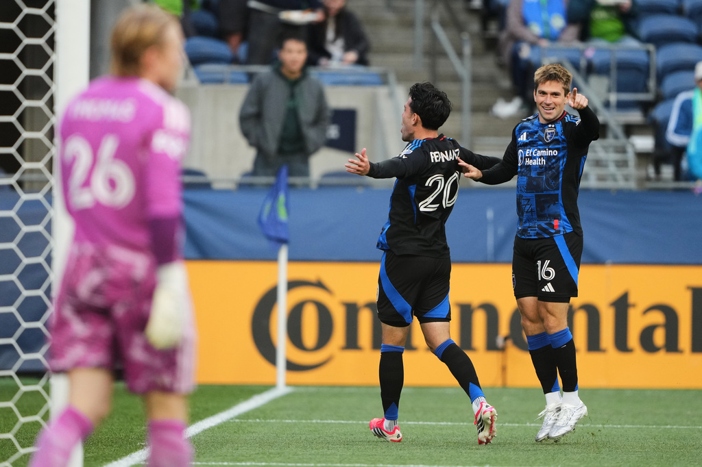 San Jose Earthquakes midfielder Nick Fernandez (20) celebrates his goal with midfielder Jack Skahan (16) against Seattle Sounders goalkeeper Andrew Thomas (26) during the first half of an MLS soccer match, Wednesday, May 13, 2026, in Seattle. (AP Photo/Lindsey Wasson)