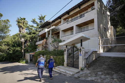 Municipal police officers patrol outside a villa where the Lebanese money changer Mohammad Srour, 57, was found tortured and killed in Monte Verdi neighbourhood of Beit Meri, Lebanon, Tuesday, April 16, 2024. Lebanon&rsquo;s interior minister alleged Wednesday that the mysterious abduction and killing of a Hezbollah-linked Lebanese financier in a villa on the edge of a quiet mountain resort town earlier this month was likely the work of Israeli operatives. (AP Photo/Hassan Ammar)