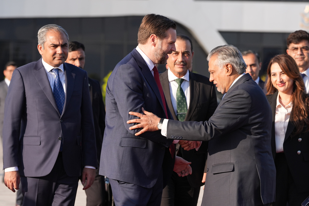 Vice President JD Vance, second left, shakes hands with Pakistani Deputy Prime Minister and Foreign Minister Mohammad Ishaq Dar, as Pakistan's Interior Minister Mohsin Naqvi, left, Pakistan's Chief of Defence Forces Chief of Army Staff Field Marshall Asim Munir, third left, and Charge d'Affaires of the U.S. Embassy in Islamabad Natalie A. Baker, right, look on, as he prepares to board Air Force Two after attending talks on Iran in Islamabad, Pakistan, Sunday, April 12, 2026. (AP Photo/Jacquelyn Martin, Pool)