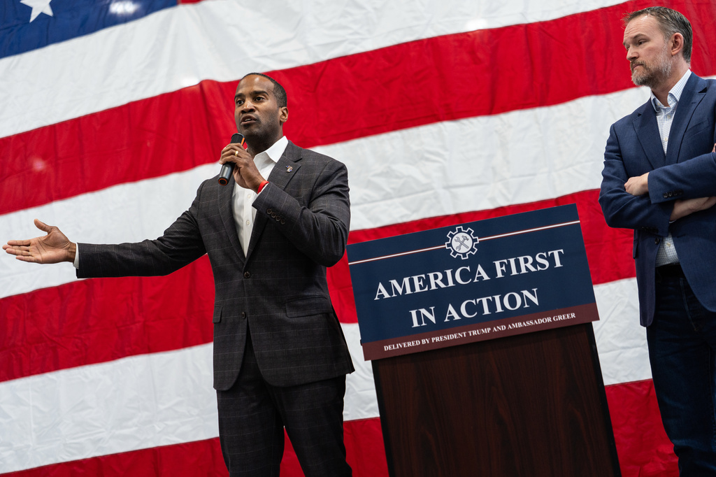 U.S. Trade Representative Jamieson Greer, right, listens to Rep. John James, R-Mich., left, speak during a tour of Atomic Industries' manufacturing facility, Thursday, April 9, 2026, in Warren, Mich. (AP Photo/Julia Demaree Nikhinson)