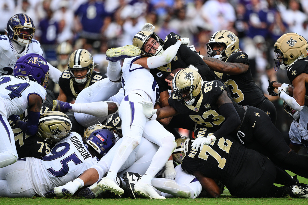 iNew Orleans Saints quarterback Tyler Shough converts on a fourth and one for a first down n the second half of an NFL football game in Baltimore, Sunday, Sept. 20, 2026. (AP Photo/Nick Wass)
