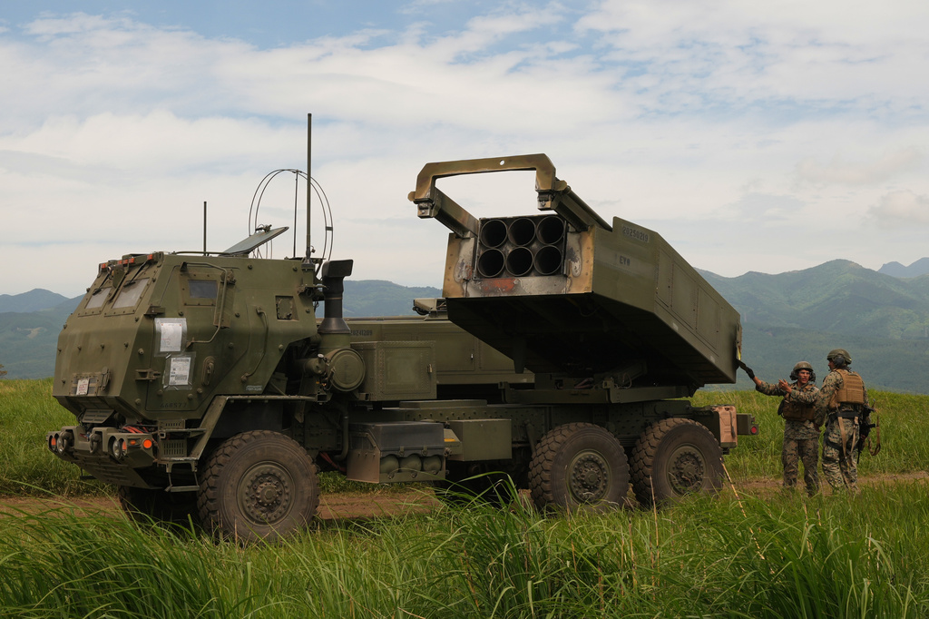 U.S. Marines show the High Mobility Artillery Rocket System (HIMARS) mounted on trucks during a media tour after they conducted its live-fire training at Camp Fuji, in Gotemba, southwest of Tokyo, Wednesday, May 20, 2026. (AP Photo/Hiro Komae)