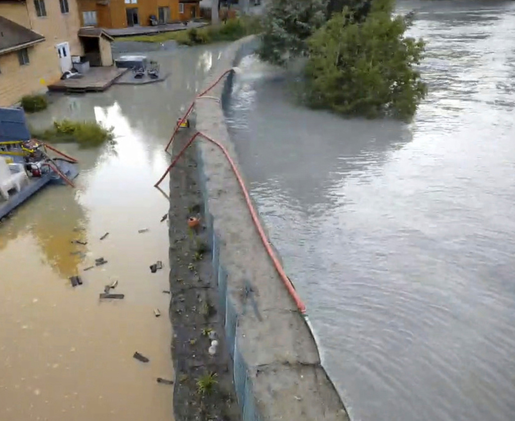 This drone image provided by the City and Borough of Juneau shows flooding from a release of water and snowmelt at Mendenhall Glacier covered some roads and threatened homes along the Mendenhall River in Juneau, Alaska on Wednesday, Aug. 13, 2025. (City and Borough of Juneau via AP)