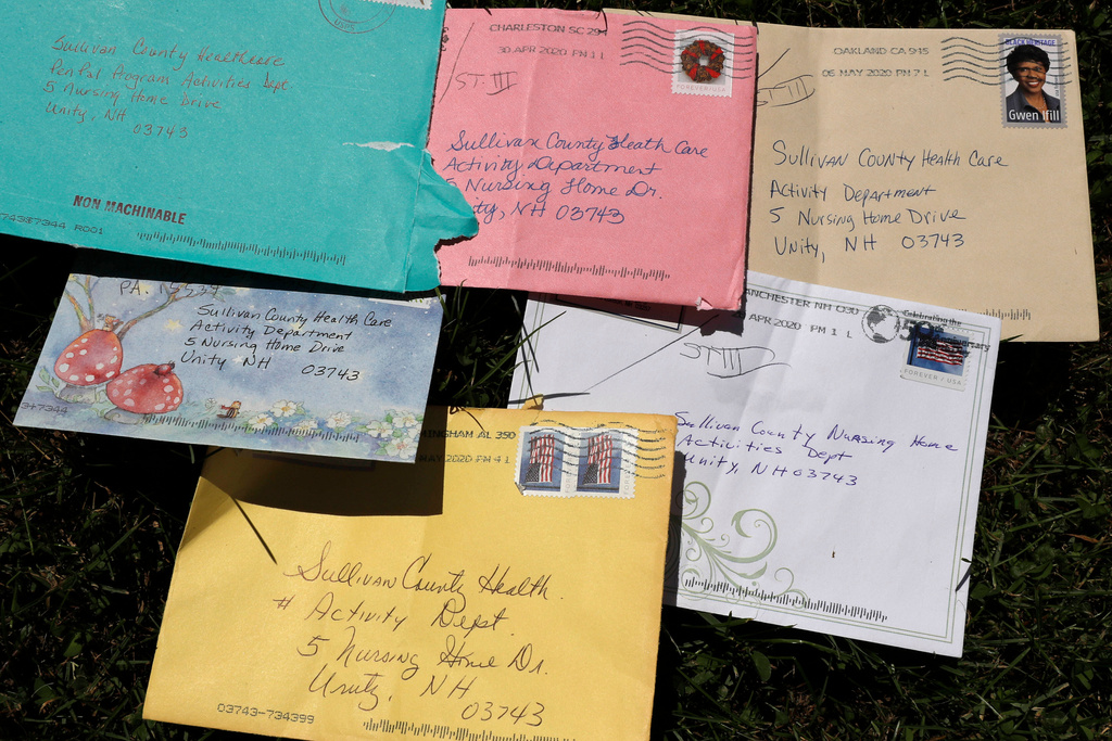 Pen pal letters are displayed outside the Sullivan County Health Care nursing home in Unity, N.H., June 8, 2020. (AP Photo/Charles Krupa, File)