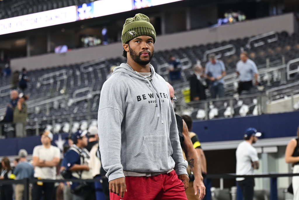 Arizona Cardinals quarterback Kyler Murray walks on the field during warmups before an NFL football game against the Dallas Cowboys Monday, Nov. 3, 2025, in Arlington, Texas. (AP Photo/Jessica Tobias)