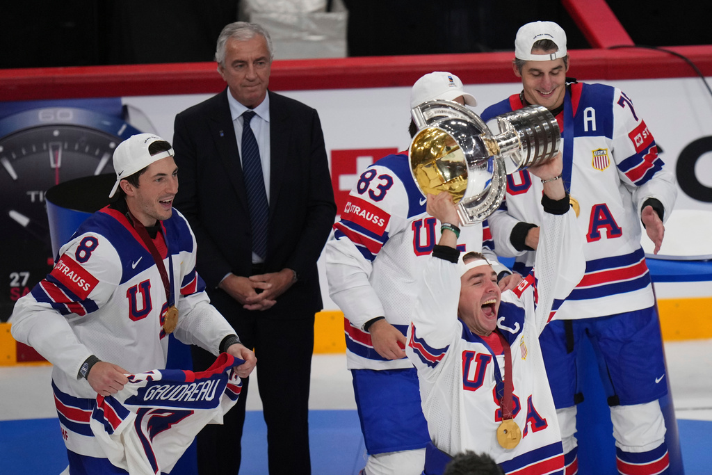 FILE - United States' Clayton Keller holds up the tropy after the final match between United States and Switzerland at the ice hockey world championships in Stockholm, Sweden, Sunday, May 25, 2025. (AP Photo/Petr David Josek, File)
