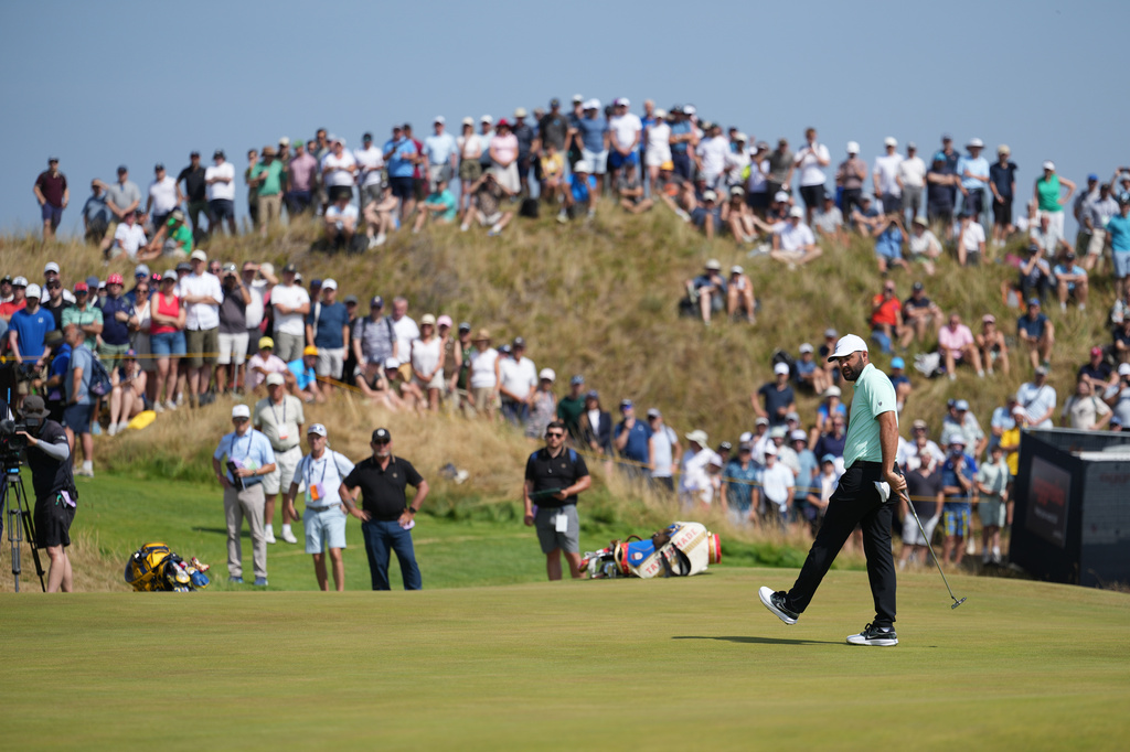Scottie Scheffler of the United States reacts after putting on the 6th green during the first day of the British Open Golf championships at Royal Birkdale golf club, in Southport, England, Thursday, July 16, 2026. (AP Photo/Jon Super)