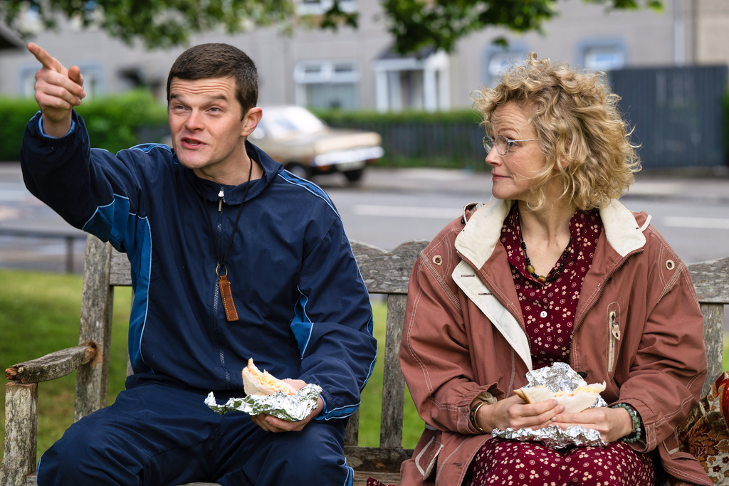 This image released by Sony Pictures Classics shows Robert Aramayo, left, and Maxine Peake in a scene from "I Swear." (Graeme Hunter/Sony Pictures Classics via AP)