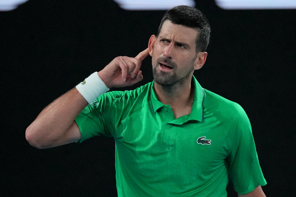 Novak Djokovic of Serbia reacts after defeating Botic van de Zandschulp of the Netherlands in their third round match at the Australian Open tennis championship in Melbourne, Australia, Saturday, Jan. 24, 2026. (AP Photo/Dita Alangkara)