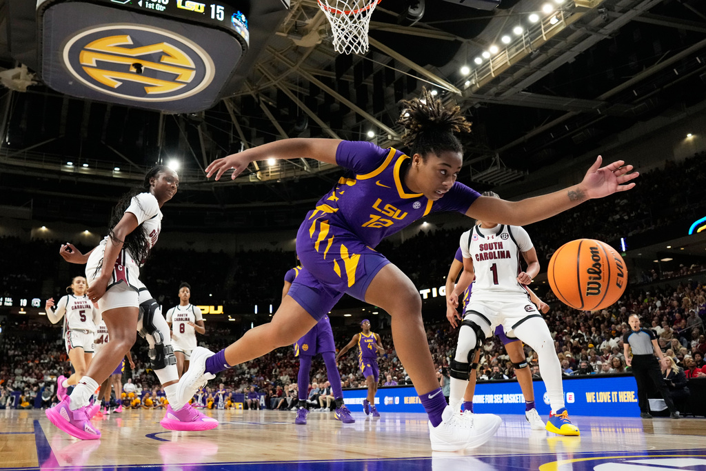 LSU guard Mikaylah Williams goes after a loose ball against South Carolina during the first half of an NCAA college basketball game in the semifinals of the Southeastern Conference tournament, Saturday, March 7, 2026, in Greenville, S.C. (AP Photo/Chris Carlson)