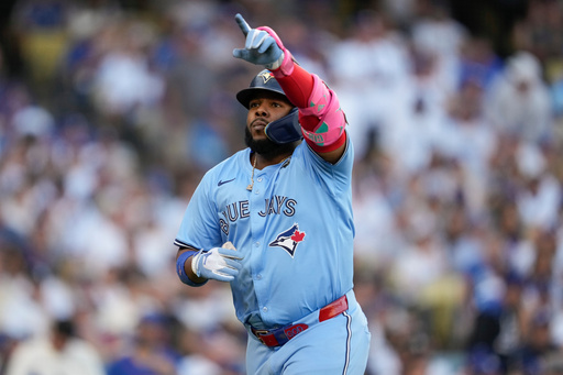 Toronto Blue Jays' Vladimir Guerrero Jr. celebrates his solo home run during the first inning in Game 5 of baseball's World Series against the Los Angeles Dodgers, Wednesday, Oct. 29, 2025, in Los Angeles. (AP Photo/Ashley Landis) Toronto Blue Jays' Vladimir Guerrero Jr. celebrates his solo home run during the first inning in Game 5 of baseball's World Series against the Los Angeles Dodgers, Wednesday, Oct. 29, 2025, in Los Angeles. (AP Photo/Ashley Landis)