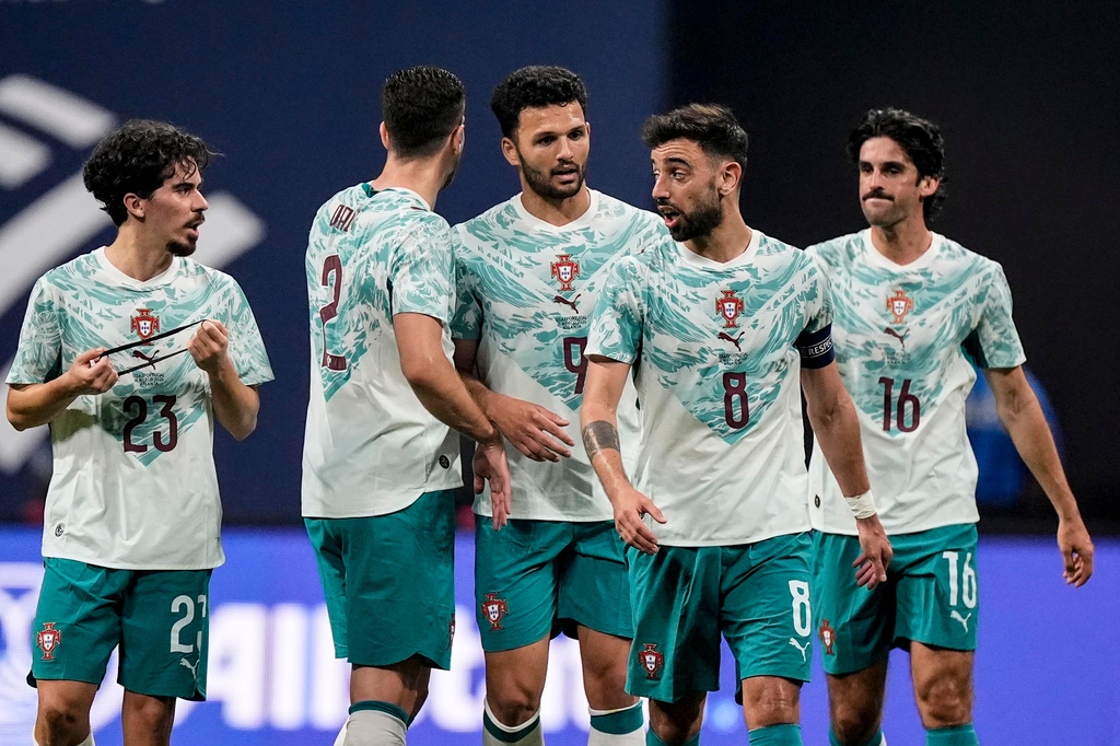 Portugal team mates celebrate a goal against the USA during the first half of an international friendly soccer match, Tuesday, March 31, 2026, in Atlanta. (AP Photo/Mike Stewart)