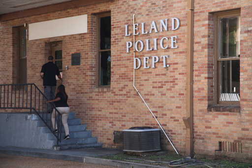 Members of the Leland Police Department enter the police station in Leland, Miss., Saturday, Oct. 11, 2025, after a homecoming shooting. (AP Photo/Katie Adkins) Members of the Leland Police Department enter the police station in Leland, Miss., Saturday, Oct. 11, 2025, after a homecoming shooting. (AP Photo/Katie Adkins)