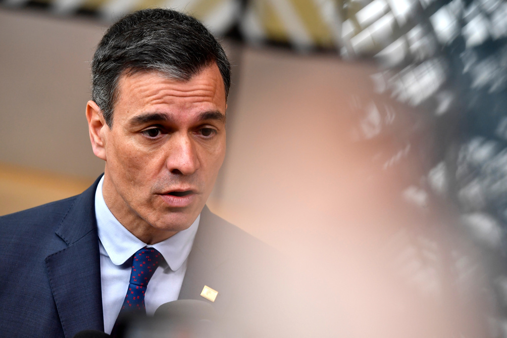 FILE - Spain's Prime Minister Pedro Sanchez speaks with the media as he arrives for an EU summit at the European Council building in Brussels, Thursday, March 23, 2023. (AP Photo/Geert Vanden Wijngaert, File)