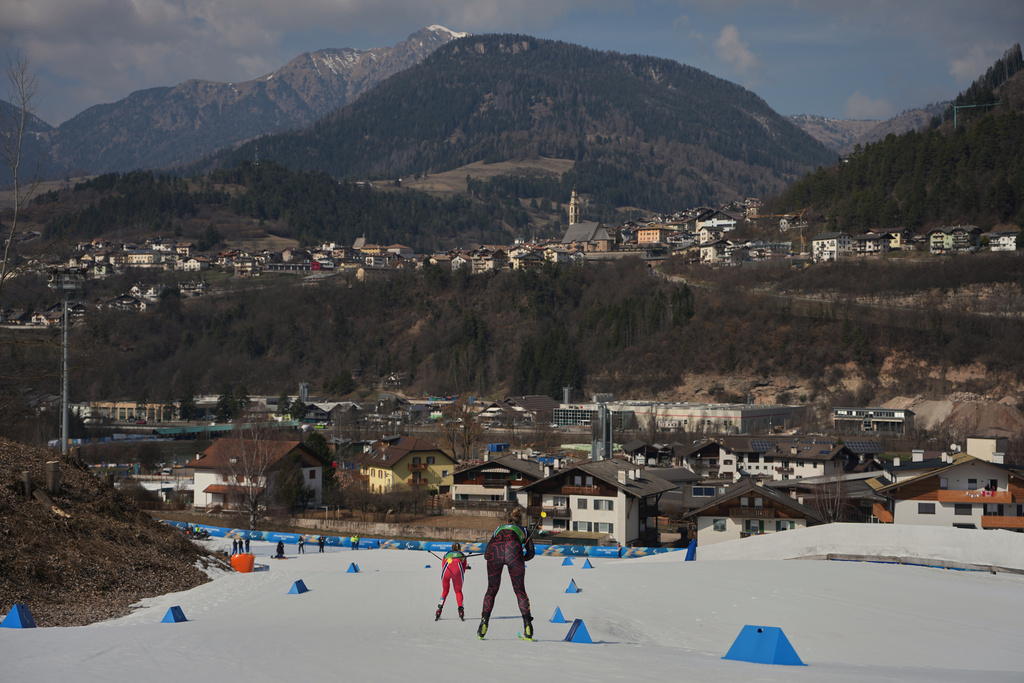 Norway's Vilde Nilsen, gold, is followed by Germany's Kathrin Marchand, 4th, in the cross country skiing women’s sprint classic standing at the 2026 Winter Paralympics, in Tesero, Italy, Tuesday, March 10, 2026. (AP Photo/Emilio Morenatti)