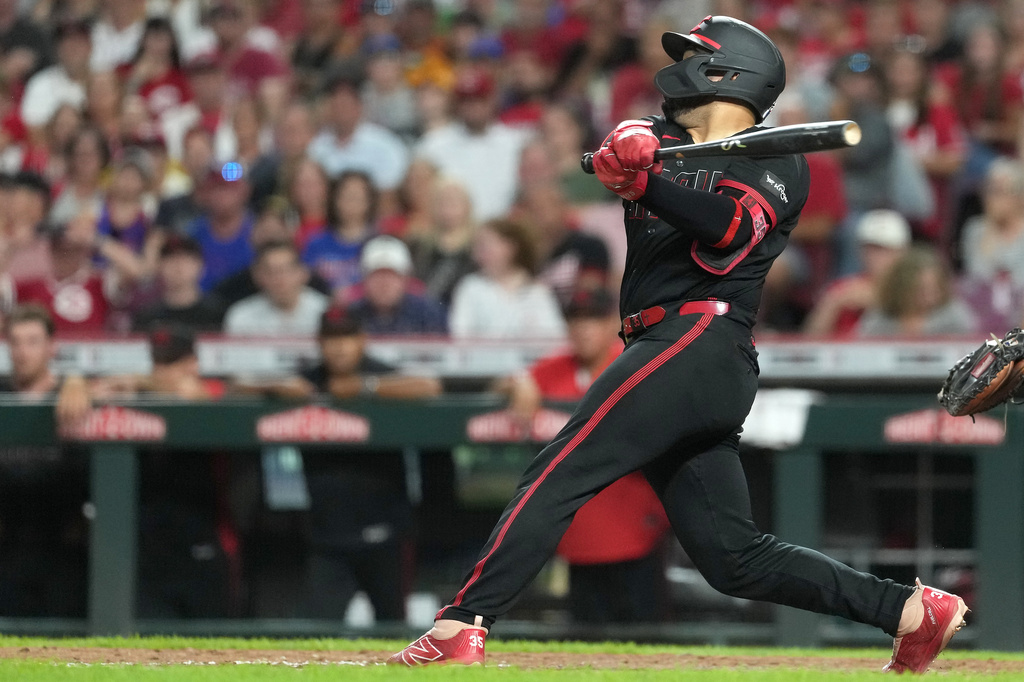 Cincinnati Reds' Jose Trevino hits a two-run single during the sixth inning a baseball game against the Chicago Cubs, Friday, Sept. 18, 2026, in Cincinnati. (AP Photo/Kareem Elgazzar)