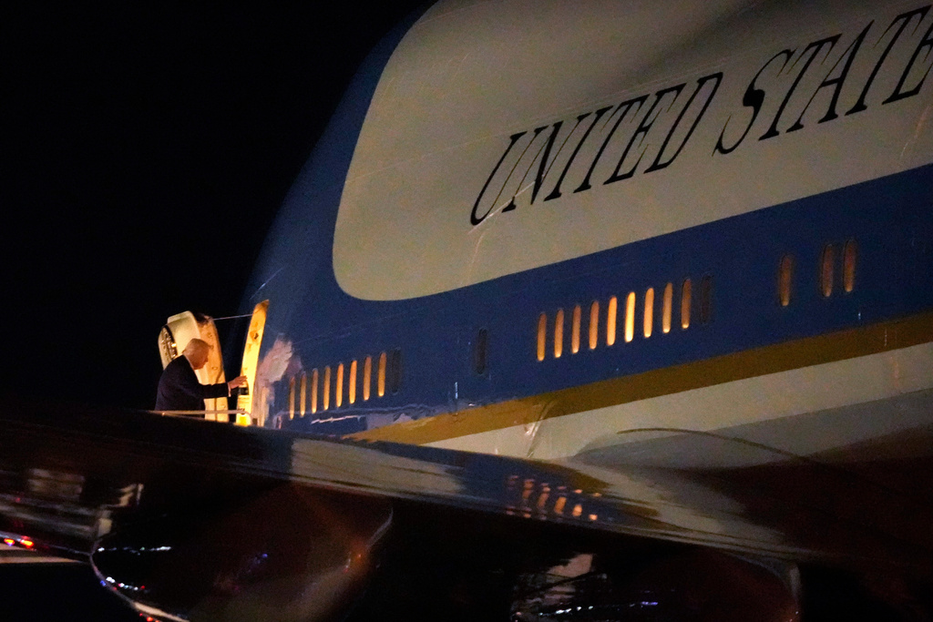 President Donald Trump boards Air Force One, Sunday, Feb. 8, 2026, at Palm Beach International Airport in West Palm Beach, Fla. (AP Photo/Mark Schiefelbein)