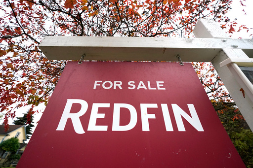 FILE - A Redfin "for sale" sign stands in front of a house on Oct. 28, 2020, in Seattle. (AP Photo/Elaine Thompson, File) FILE - A Redfin "for sale" sign stands in front of a house on Oct. 28, 2020, in Seattle. (AP Photo/Elaine Thompson, File)