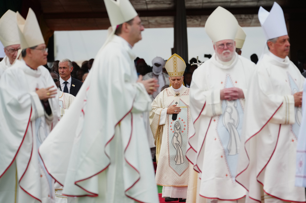 Pope Leo XIV arrives in procession with cardinals and bishops to celebrate Mass at Yaounde Ville Airport, Cameroon, Saturday, April 18, 2026 on the sixth day of his 11-day pastoral visit to Africa. (AP Photo/Andrew Medichini)