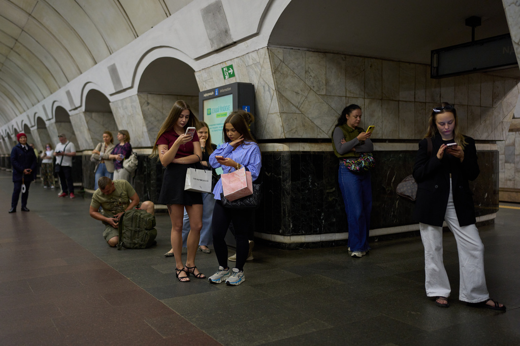Commuters shelter at Palats Sportu metro station during an air raid alarm in Kyiv, Ukraine, Thursday, Aug. 27, 2026. (AP Photo/Francisco Seco)