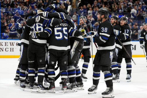 Teammates mob Tampa Bay Lightning right wing Nikita Kucherov (86) after picking up an assist, for his 1,000th career point, on a goal by Brayden Point during the second period of an NHL hockey game against the Anaheim Ducks Saturday, Oct. 25, 2025, in Tampa, Fla. (AP Photo/Chris O'Meara) Teammates mob Tampa Bay Lightning right wing Nikita Kucherov (86) after picking up an assist, for his 1,000th career point, on a goal by Brayden Point during the second period of an NHL hockey game against the Anaheim Ducks Saturday, Oct. 25, 2025, in Tampa, Fla. (AP Photo/Chris O'Meara)