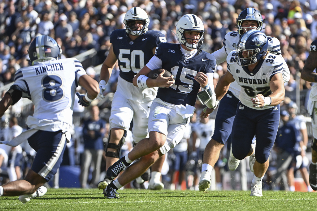 Penn State quarterback Drew Allar (15) runs against Nevada during the second quarter of an NCAA college football game, Saturday, Aug. 30, 2025, in State College, Pa. (AP Photo/Barry Reeger)