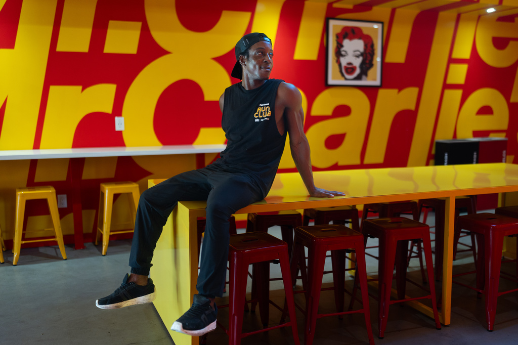Shaka Smith, a vegan influencer who's politically an independent, poses for a portrait at his fast-food restaurant in Santa Monica, Calif., Thursday, Aug. 6, 2026. (AP Photo/Jae C. Hong)