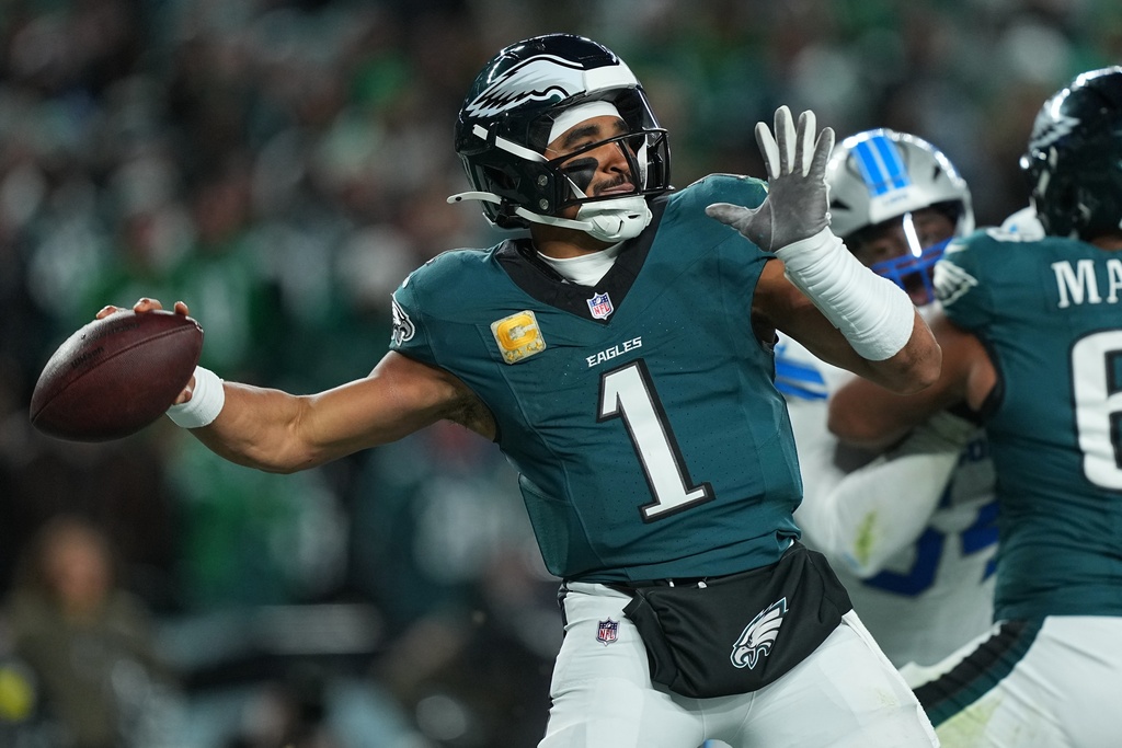 Philadelphia Eagles quarterback Jalen Hurts (1) looks to pass during the second half of an NFL football game against the Detroit Lions on Sunday, Nov. 16, 2025, in Philadelphia. (AP Photo/Matt Rourke)