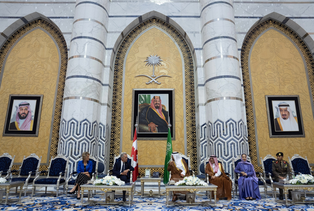 Canada Prime Minister Mark Carney and Diana Fox Carney speak with Prince Saud bin Mishaal bin Abdulaziz Al Saud, Minister of Finance of the Kingdom of Saudi Arabia Mohammed bin Abdullah Al‚ÄëJadaan and Ambassador of the Kingdom of Saudi Arabia to Canada Amal Yahya Almoalimi participate in a welcome ceremony in Jeddah, Saudi Arabia, Wednesday, July 8, 2026. (Adrian Wyld/The Canadian Press via AP)