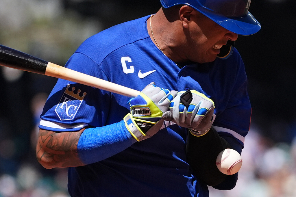Kansas City Royals' Salvador Perez is hit by a pitch from Seattle Mariners starting pitcher Luis Castillo during the fourth inning of a baseball game, Sunday, May 3, 2026, in Seattle. (AP Photo/Lindsey Wasson)