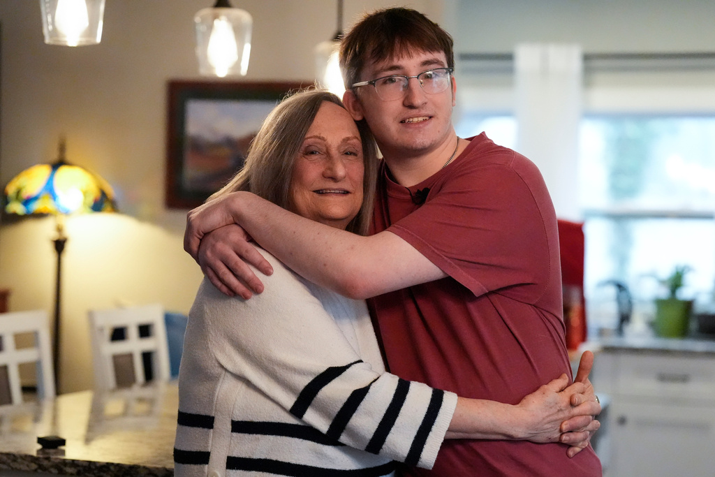 Donna West and her grandson Paul Quirk pose for a photo, Tuesday, Dec. 2, 2025, in Marietta, Ga. (AP Photo/Mike Stewart)