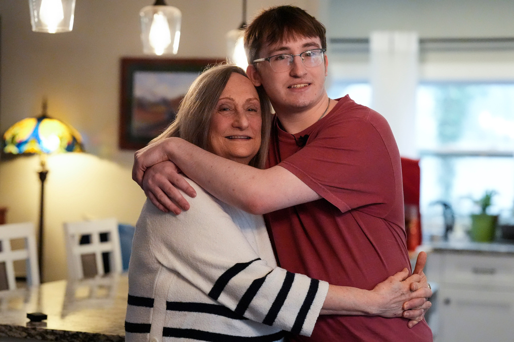 CORRECTS FIRST NAME TO DIANE - Diane West and her grandson Paul Quirk pose for a photo, Tuesday, Dec. 2, 2025, in Marietta, Ga. (AP Photo/Mike Stewart)
