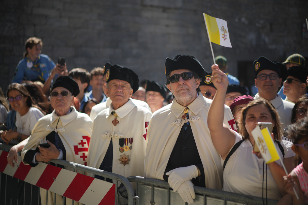 Faithful wait for Pope Leo XIV outside the Basilica during his visit to San Marino, Saturday, Aug. 22, 2026. (AP Photo/Andrew Medichini)