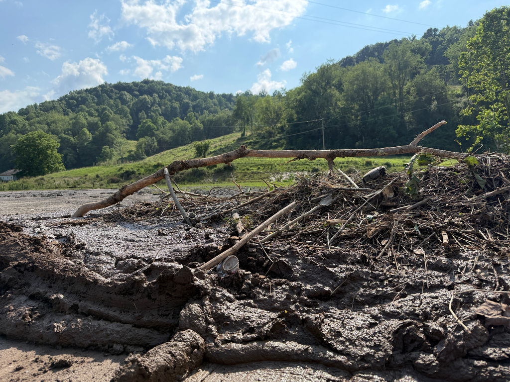 Mud and debris near Stonecoal Creek in Horner, W.Va., after severe floods on Wednesday, July 22, 2026. (AP Photo/Patrick Aftoora-Orsagos)